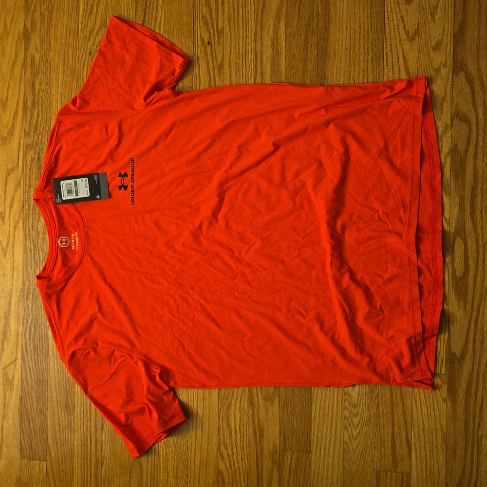 Under Armour Large shirt sleeve. Rush. Neon pink in my eyes, but some say orange